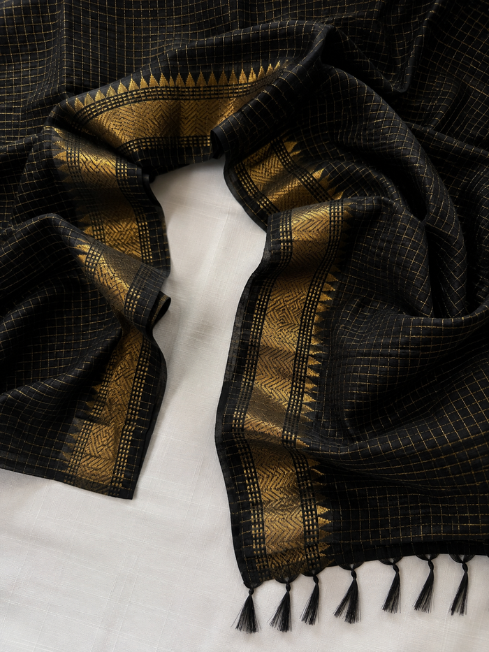 KALO MEGH- Black cotton silk saree with gold checks & woven temple border comes with blouse piece.