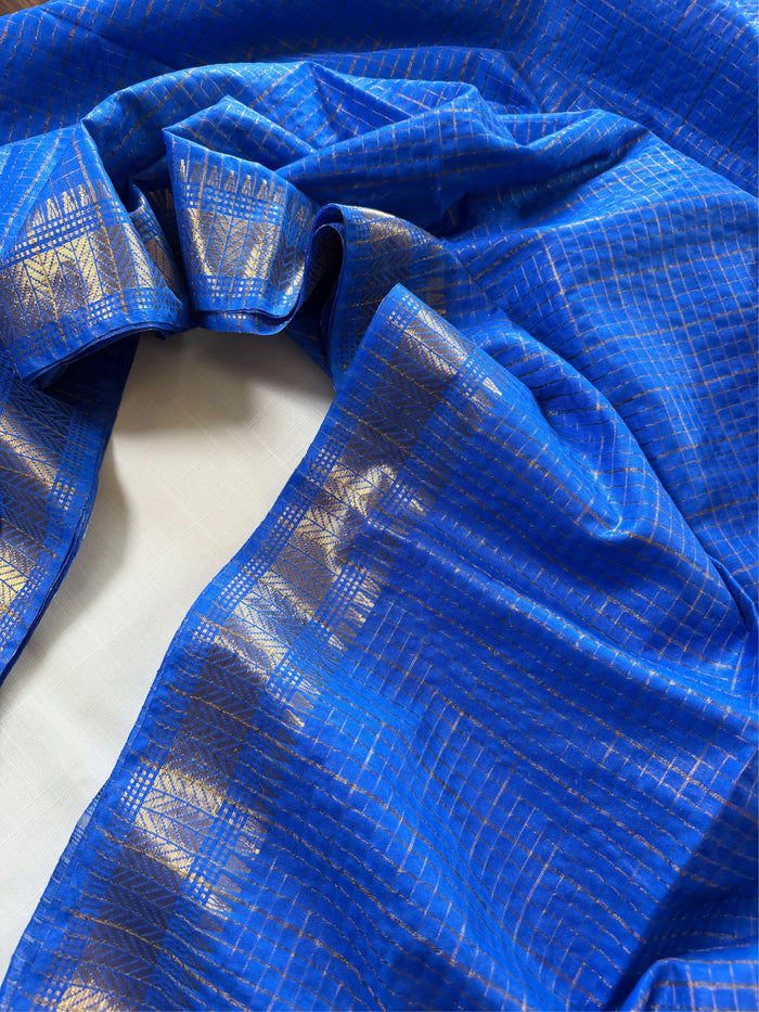 SHONAR KATHI- Blue cotton silk saree with gold checks & woven temple border comes with blouse piece.
