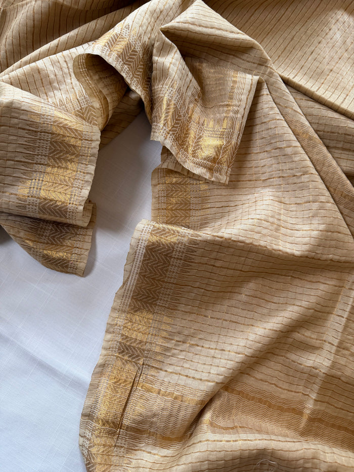 SHONAR RONG- Cream cotton silk saree with gold checks & woven temple border comes with blouse piece.