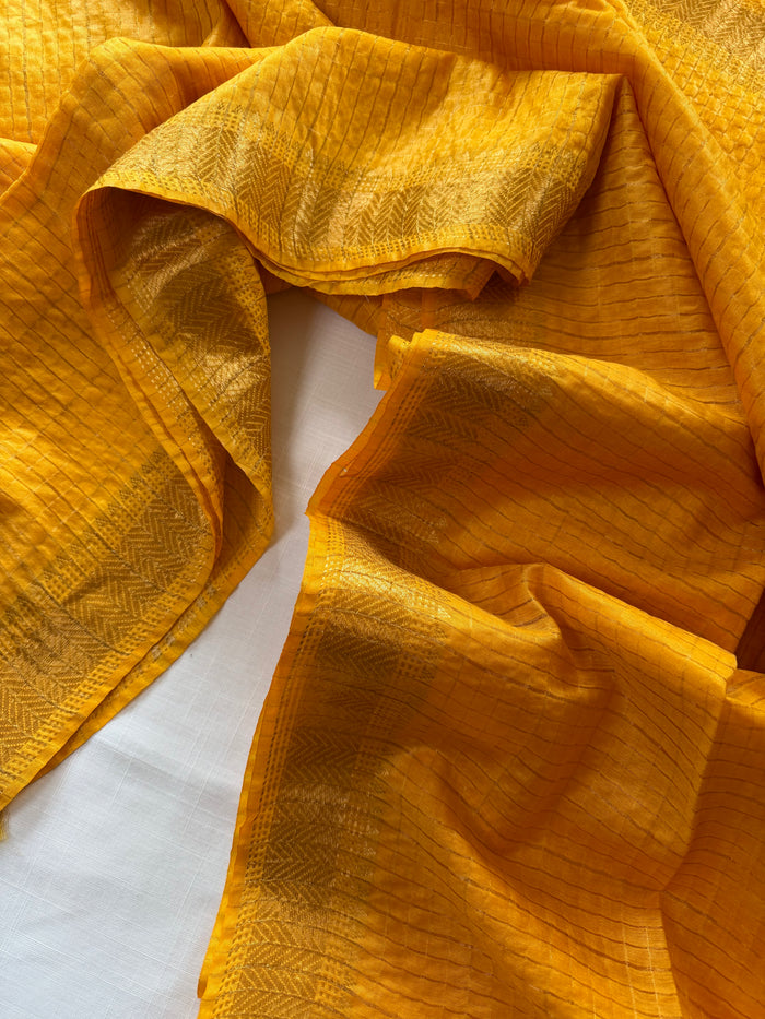 HOLUD PAKHI- Yellow cotton silk saree with gold checks & woven temple border comes with blouse piece.