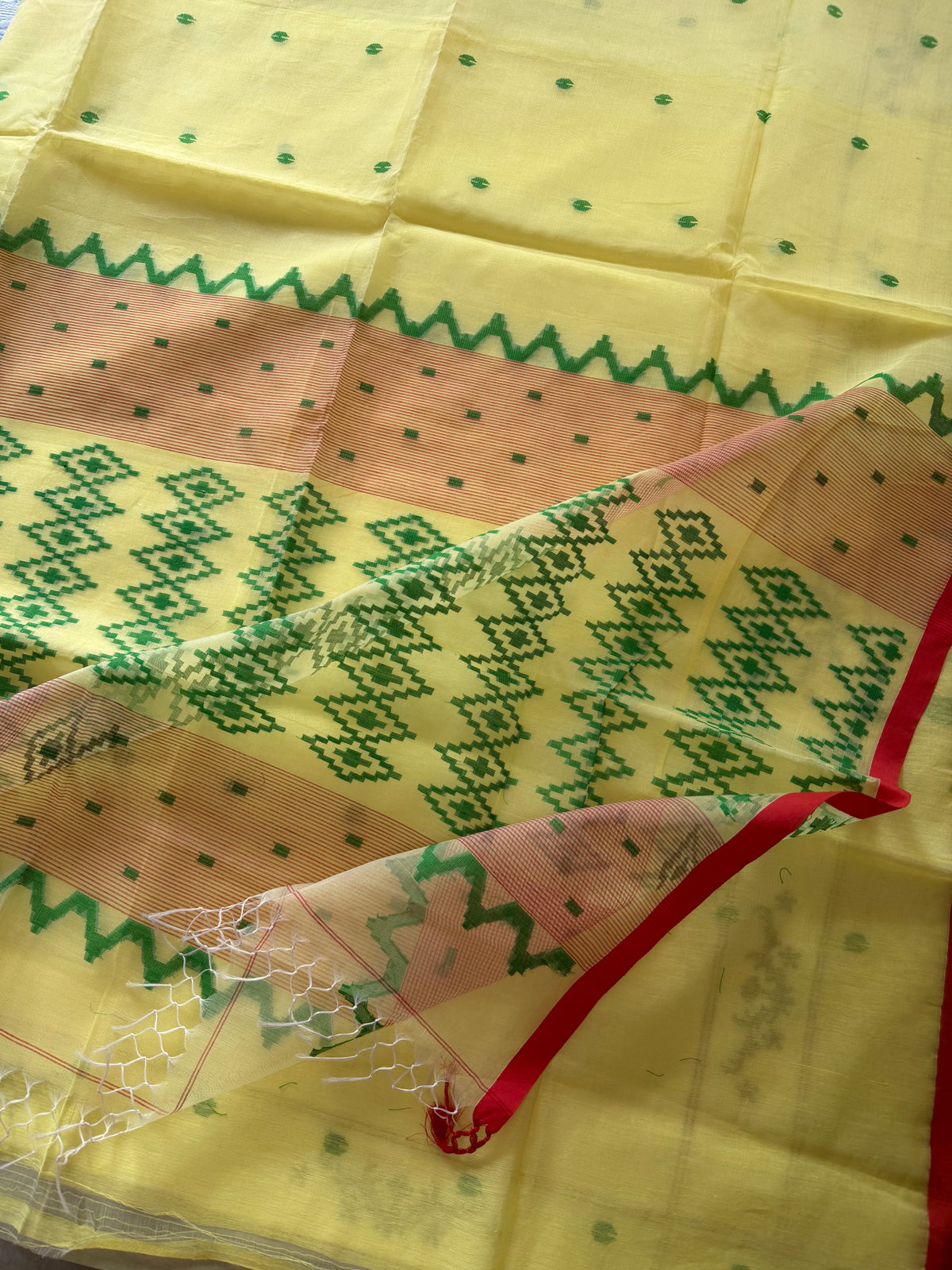 HOLUD PAAR- Light yellow muslin jamdani handwork comes with blouse piece