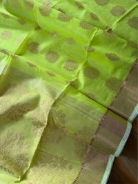 SHOBUJ SWAPNO - Parrot green cotton silk saree with zari work comes with blouse piece.