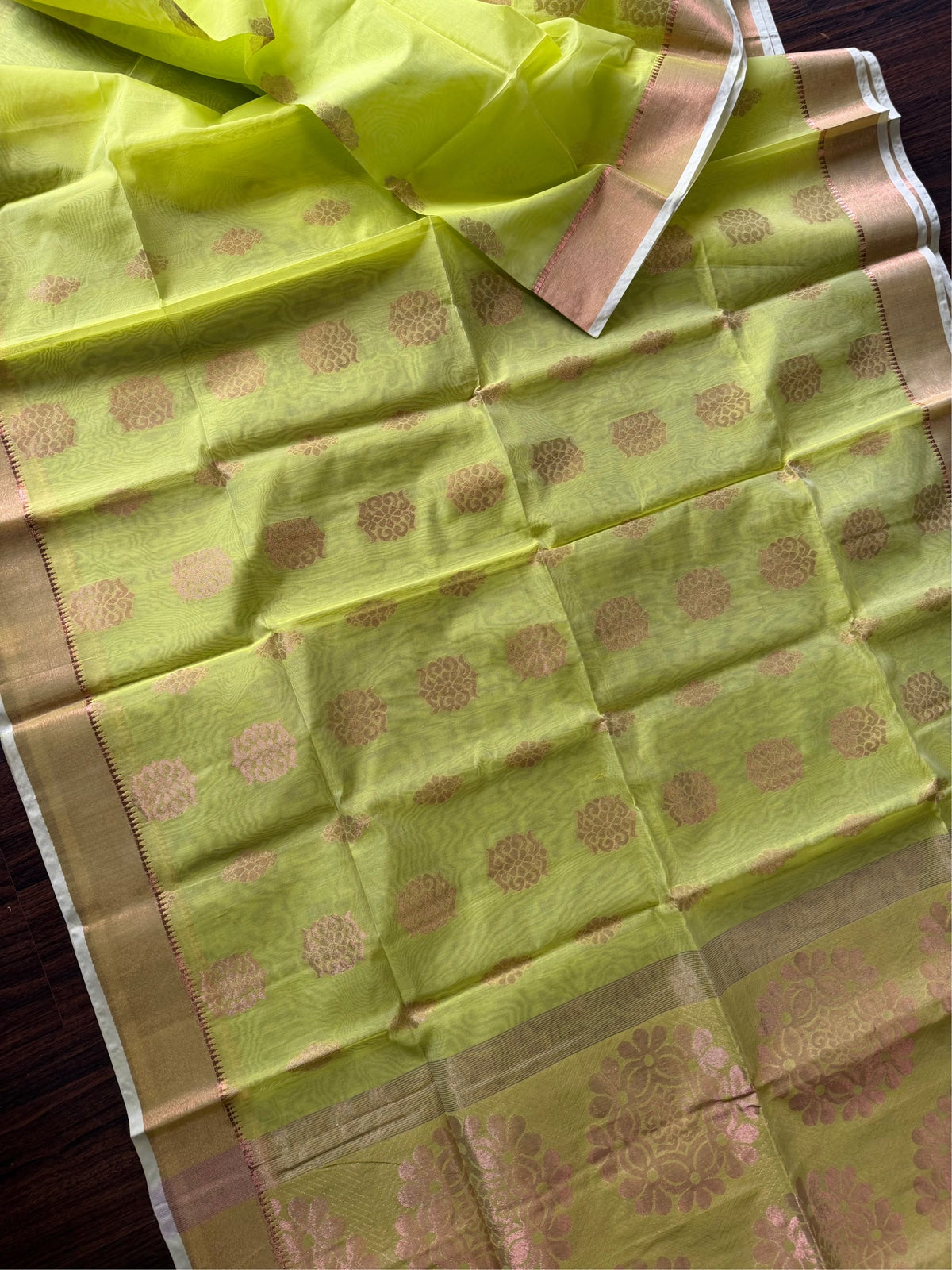 SHOBUJ SWAPNO - Parrot green cotton silk saree with zari work comes with blouse piece.