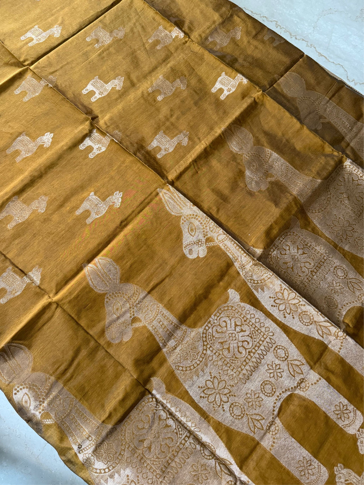SONAR CHAYYA- Brown cotton silk saree with zari work comes with blouse piece.