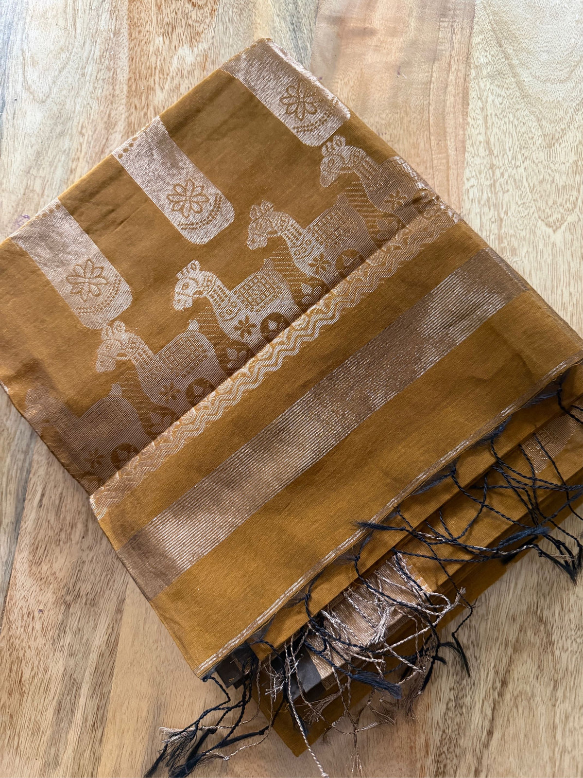 SONAR CHAYYA- Brown cotton silk saree with zari work comes with blouse piece.